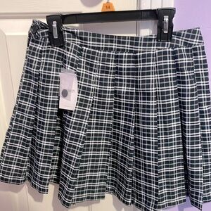 A large plaid skirt for $15.99. The colors are dark blue, gray, and white.